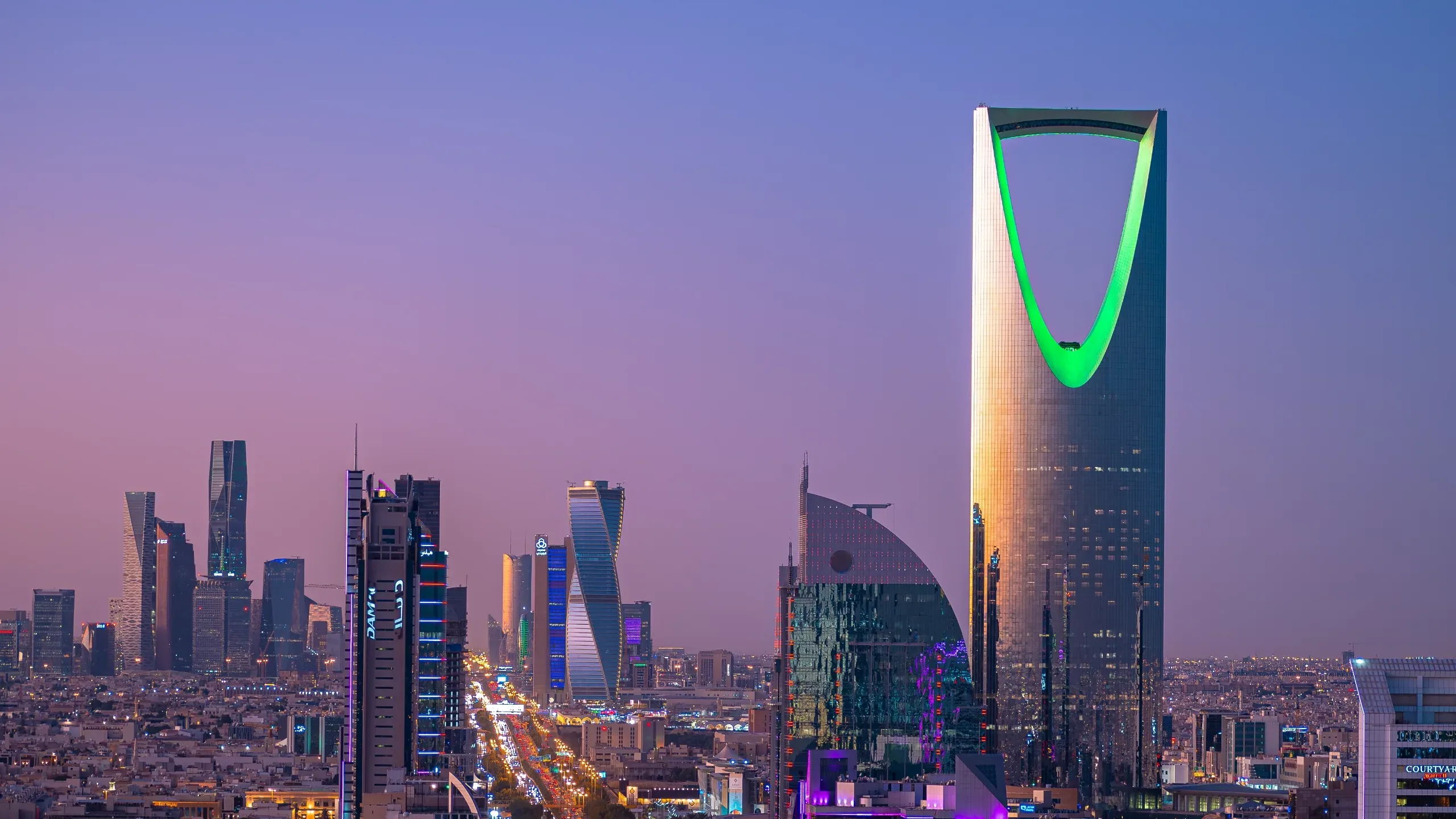 The skyline of Riyadh, Saudi Arabia, at dusk.