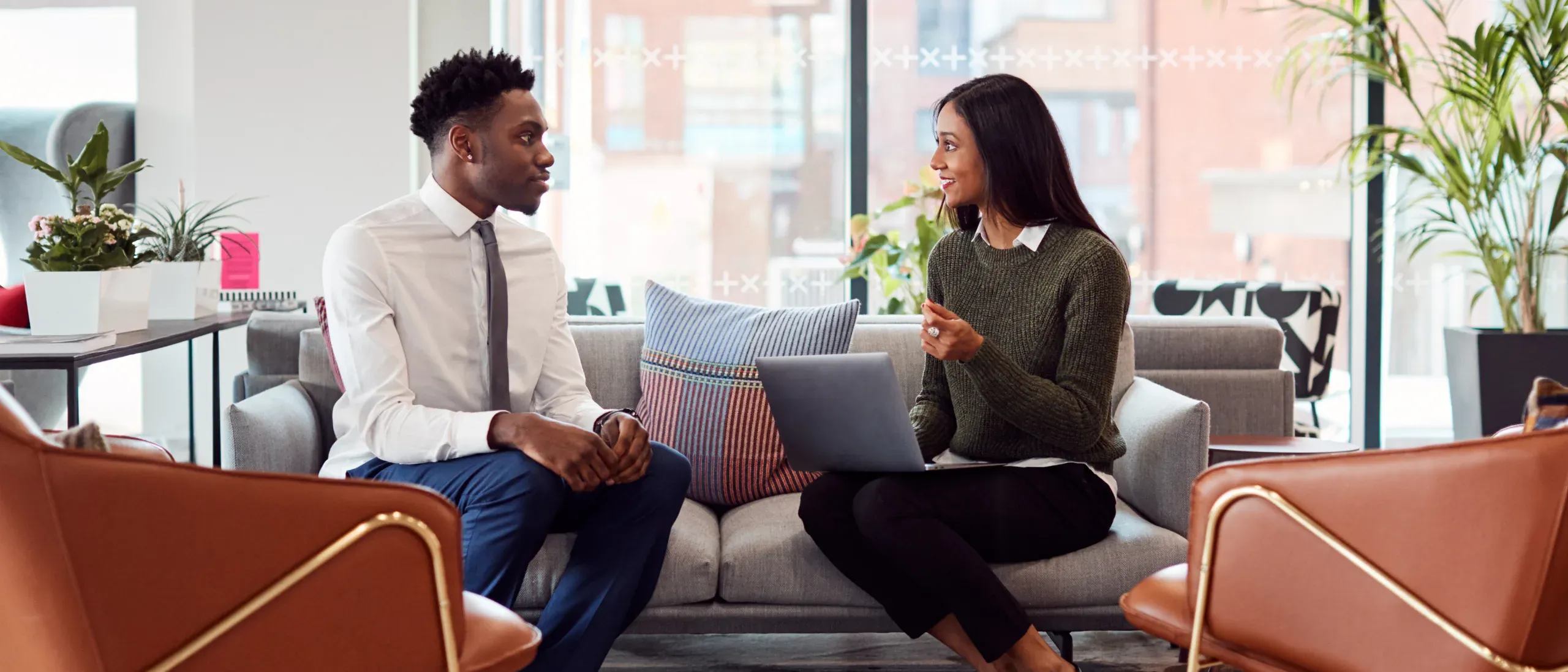 knight-frank-staff-sitting-on-a-sofa